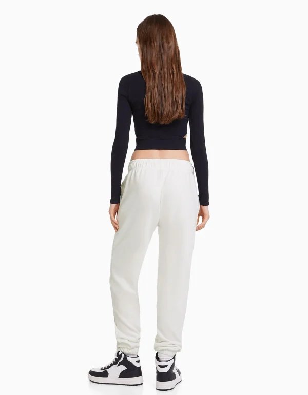 BERSHKA Pantalons*Pantalon jogger molleton imprimé Blanc